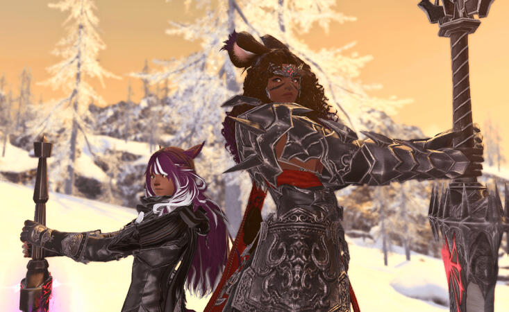 Lili'a and Emery are standing back to back, their heads tilted towards each other. Lili'a appears confident while Emery is unsure. They both have their arms out in front of themselves, holding greatswords pointed to the ground. They are in Coerthas.